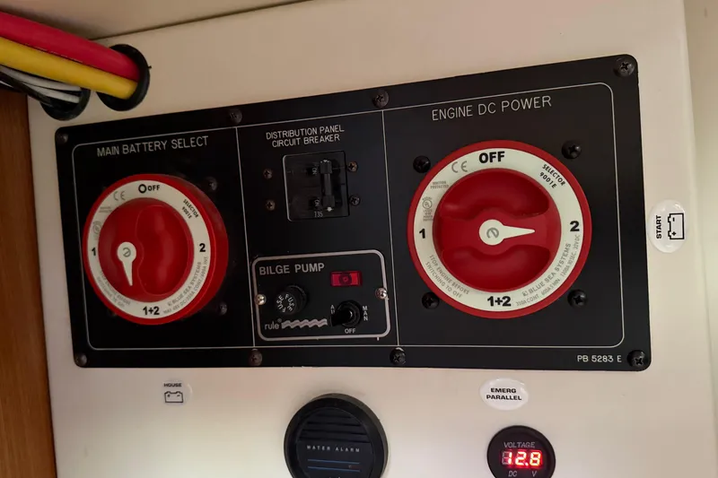 Slide: The Image of Control panel of a 2011 Catalina 355 sailboat with battery selectors and bilge pump. - 42
