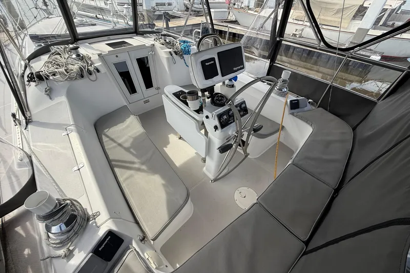 Slide: The Image of Cockpit of 2011 Catalina 355 sailboat with navigation equipment and seating. - 5