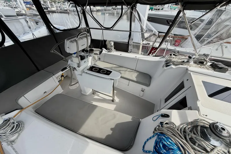Slide: The Image of Cockpit of a 2011 Catalina 355 sailboat with seating and steering wheel. - 6