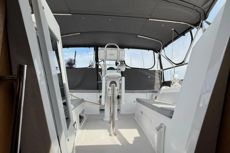 Slide: The Image of Interior view of 2011 Catalina 355 sailboat cockpit with seating and helm. - 7