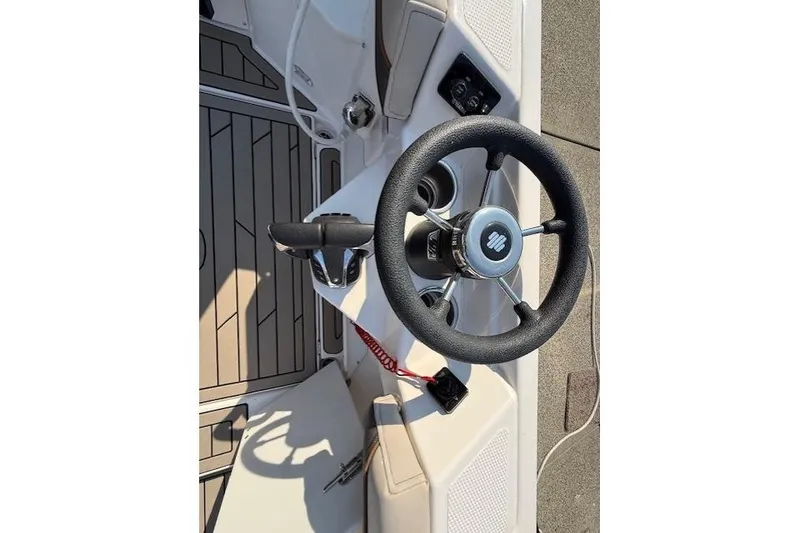 Slide: The Image of 2024 Cutwater C-288 Coupe steering wheel and controls, featuring modern design and functionality. - 14