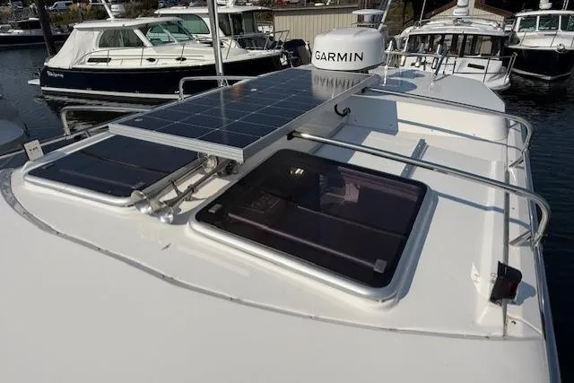 Slide: The Image of 2024 Cutwater C-288 Coupe boat with solar panels and Garmin equipment on deck. - 15