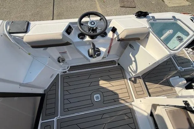 Slide: The Image of 2024 Cutwater C-288 Coupe boat cockpit with modern steering and seating. - 6
