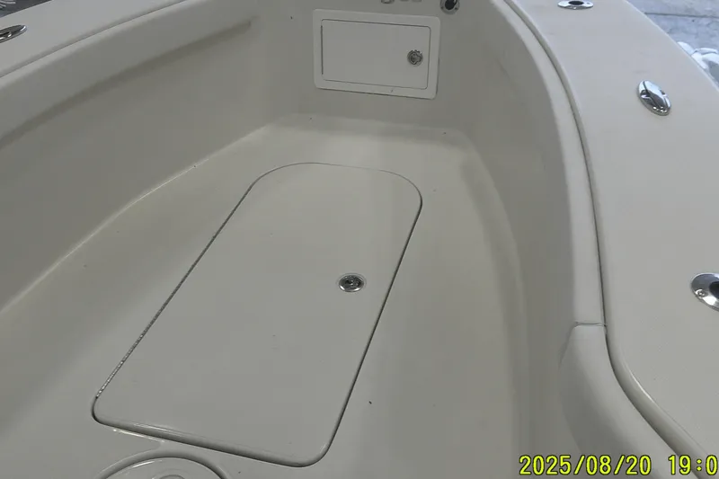 Slide: The Image of 2024 Ranger 2600 Bay boat interior with storage compartment, white finish. - 14