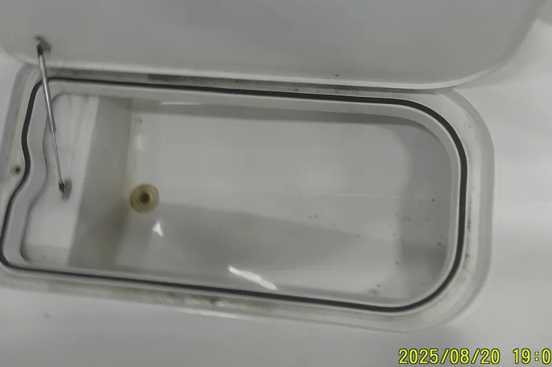 Slide: The Image of Open storage compartment on 2024 Ranger 2600 Bay boat. - 16