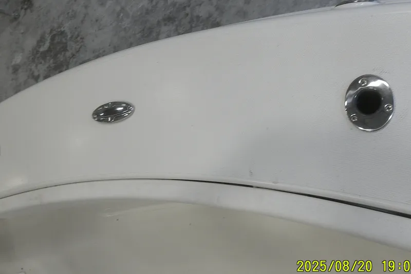 Slide: The Image of 2024 Ranger 2600 Bay boat detail with chrome fittings and white surface. - 20