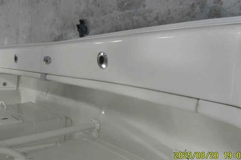 Slide: The Image of 2024 Ranger 2600 Bay boat interior detail with sleek white finish and fixtures. - 21