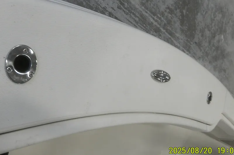 Slide: The Image of 2024 Ranger 2600 Bay boat detail with metal fittings and textured surface. - 22