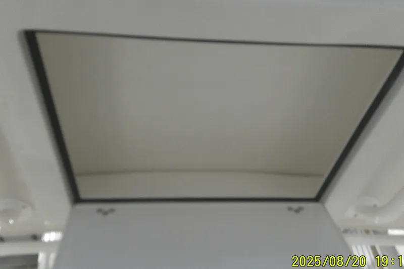 Slide: The Image of Ceiling view inside 2024 Ranger 2600 Bay boat, featuring a rectangular hatch. - 33