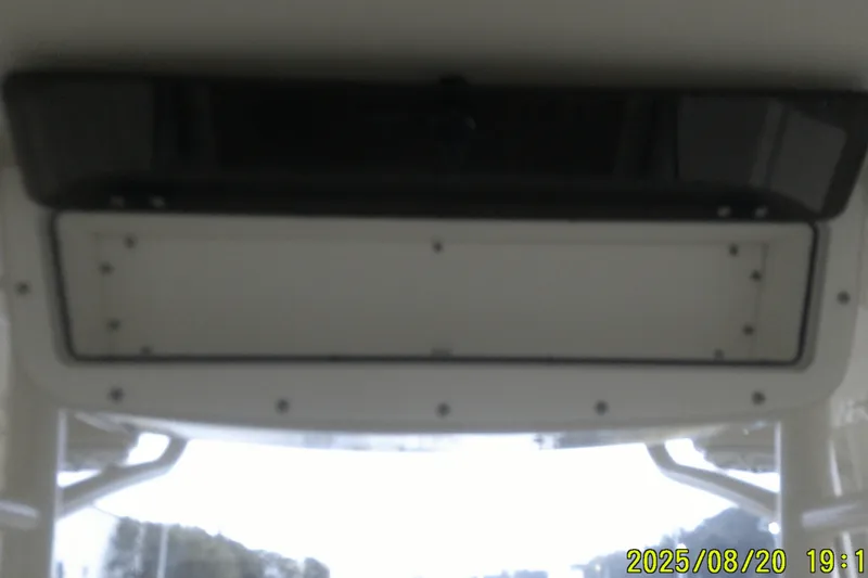 Slide: The Image of 2024 Ranger 2600 Bay boat interior, focusing on the ceiling panel and storage compartment. - 35