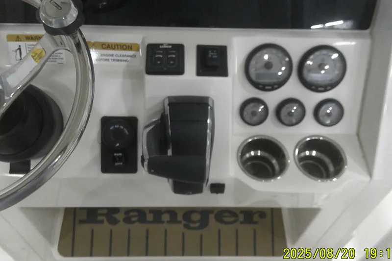 Slide: The Image of Control panel of 2024 Ranger 2600 Bay boat with steering wheel and gauges. - 38