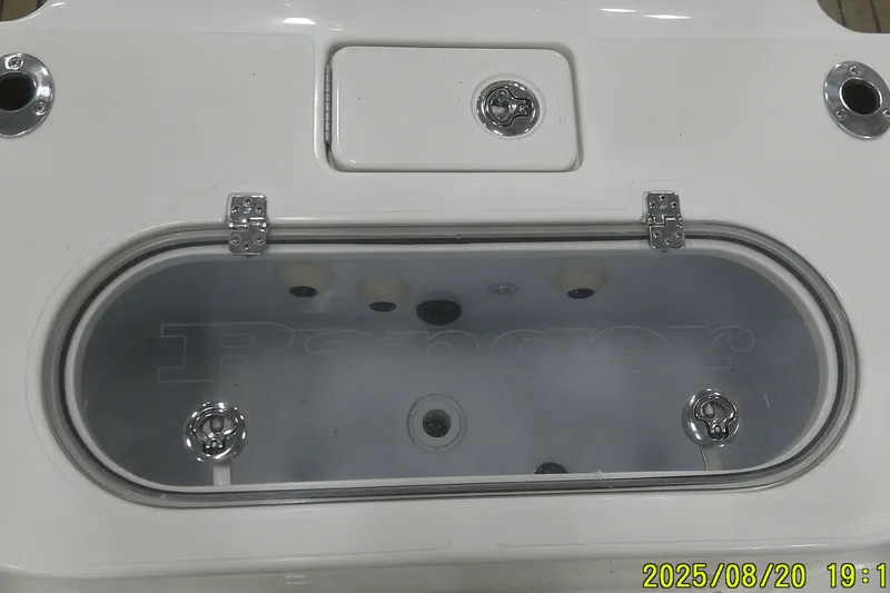 Slide: The Image of 2024 Ranger 2600 Bay boat livewell with stainless steel fittings and clear lid. - 50