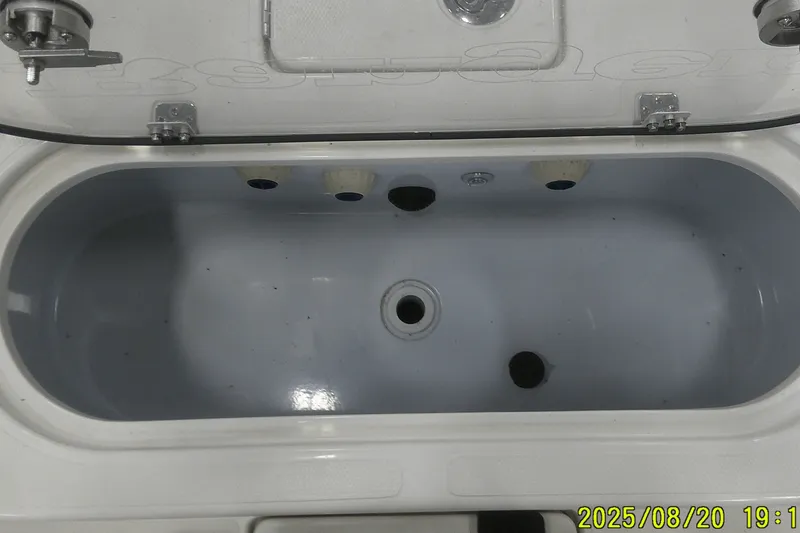 Slide: The Image of 2024 Ranger 2600 Bay livewell, open lid, interior view. - 51