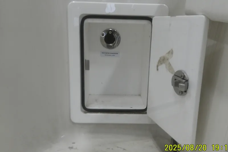 Slide: The Image of Open hatch on 2024 Ranger 2600 Bay boat, showing interior compartment. - 57