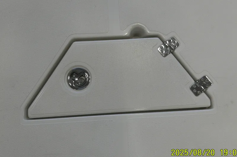 Slide: The Image of 2024 Ranger 2600 Bay boat hatch with metal hinges and latch. - 9