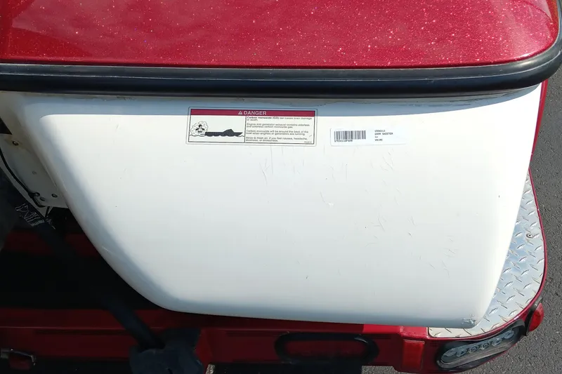 Slide: The Image of 2009 Skeeter ZX190 boat rear view with warning label and red accents. - 12