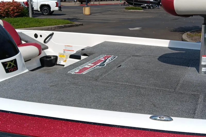 Slide: The Image of 2009 Skeeter ZX190 boat deck with logo, parked in a lot. - 2