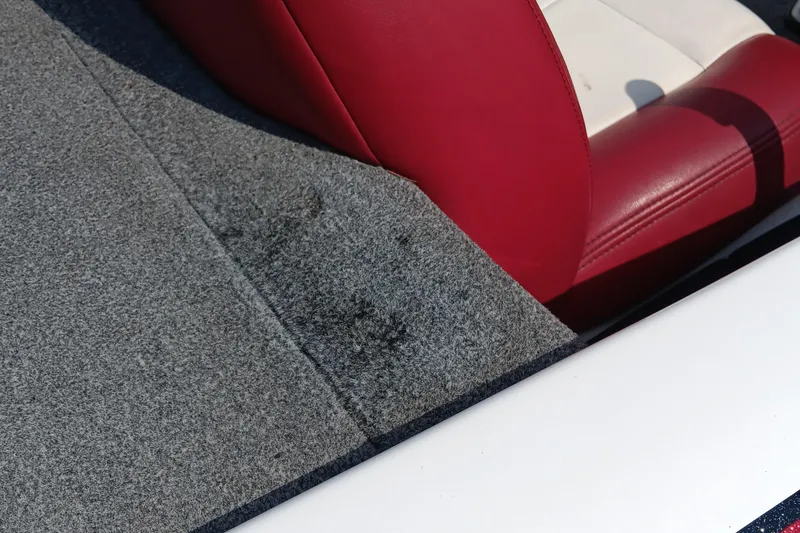 Slide: The Image of 2009 Skeeter ZX190 boat interior with red and white seating, gray carpet. - 5