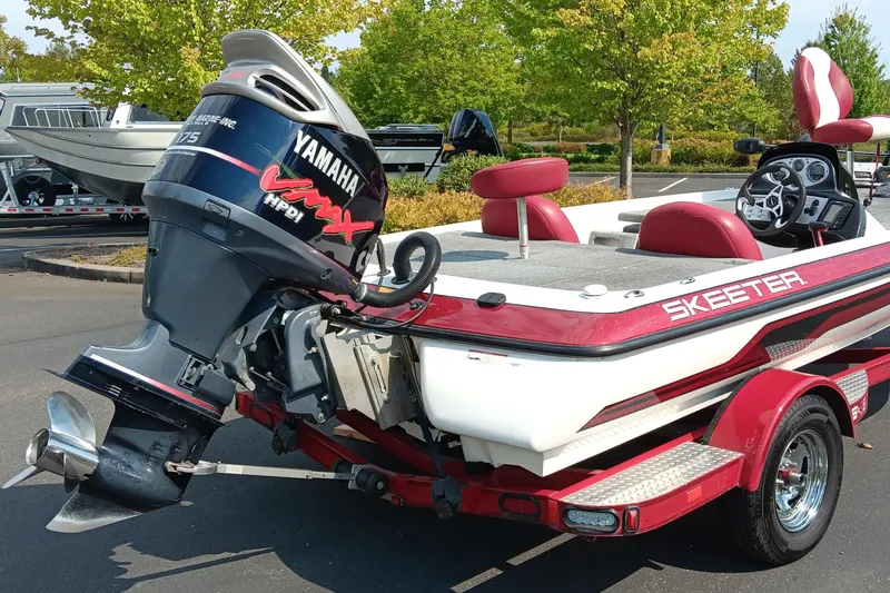 Slide: The Image of 2009 Skeeter ZX190 boat with Yamaha VMAX engine, parked outdoors. - 8