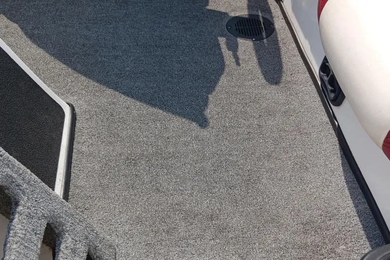 Slide: The Image of 2009 Skeeter ZX190 boat interior with gray carpet and seating. - 9