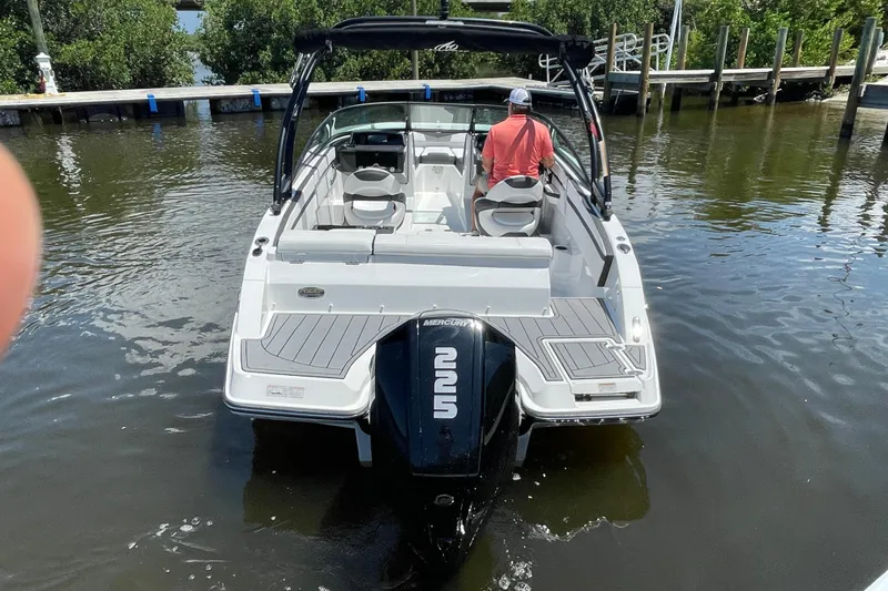 Slide: The Image of 2021 Monterey M225 boat with outboard motor on calm water, rear view. - 15