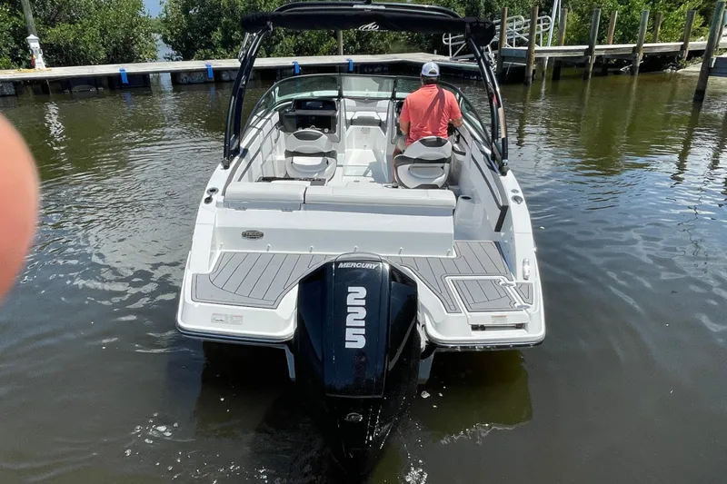 Slide: The Image of 2021 Monterey M225 boat with Mercury engine on water, rear view. - 16
