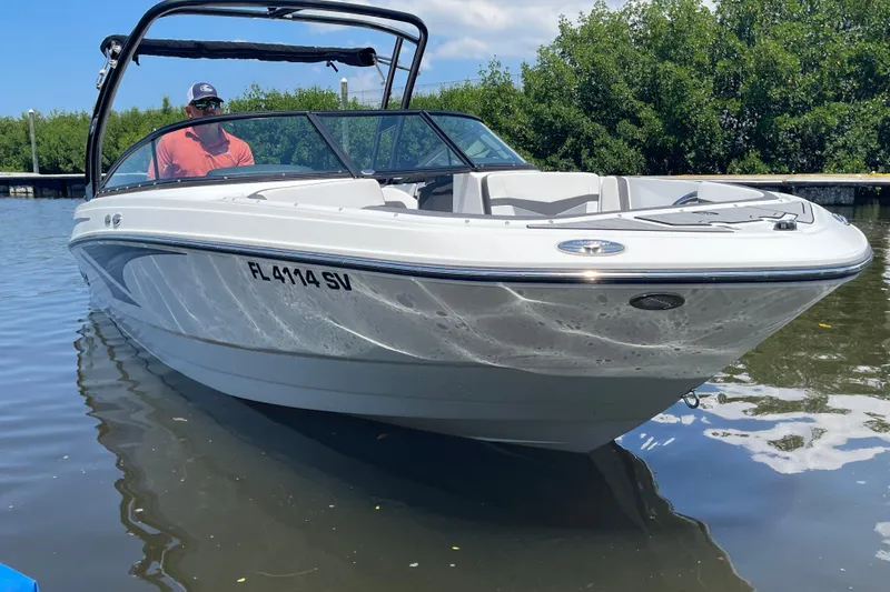 Slide: The Image of 2021 Monterey M225 boat on water, featuring sleek design and modern features. - 3