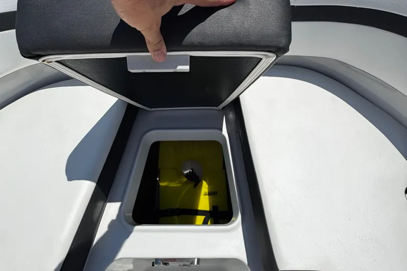 Slide: The Image of Open storage compartment on a 2021 Monterey M225 boat, revealing interior space. - 31