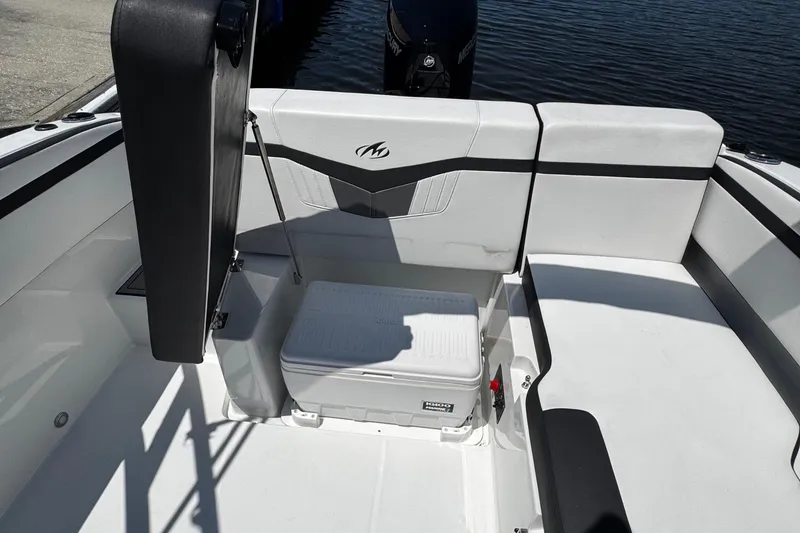 Slide: The Image of 2021 Monterey M225 boat interior with seating and storage compartment. - 34