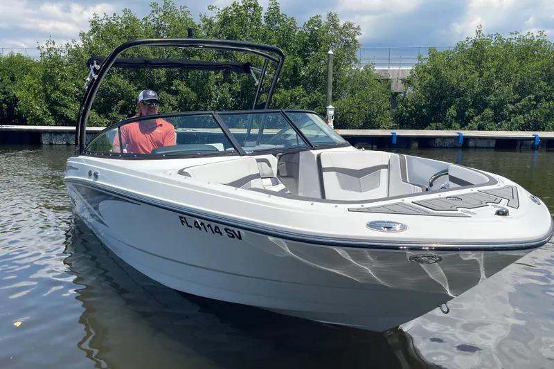 Slide: The Image of 2021 Monterey M225 boat on water, featuring sleek design and modern features. - 4