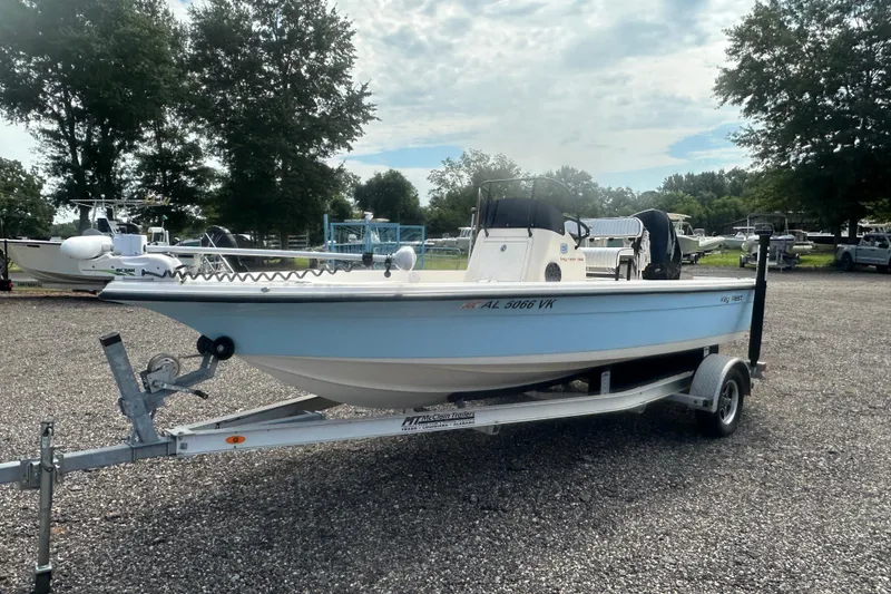 The Image of 2003 Key West 196 Bay Reef boat on trailer in outdoor setting. - 1