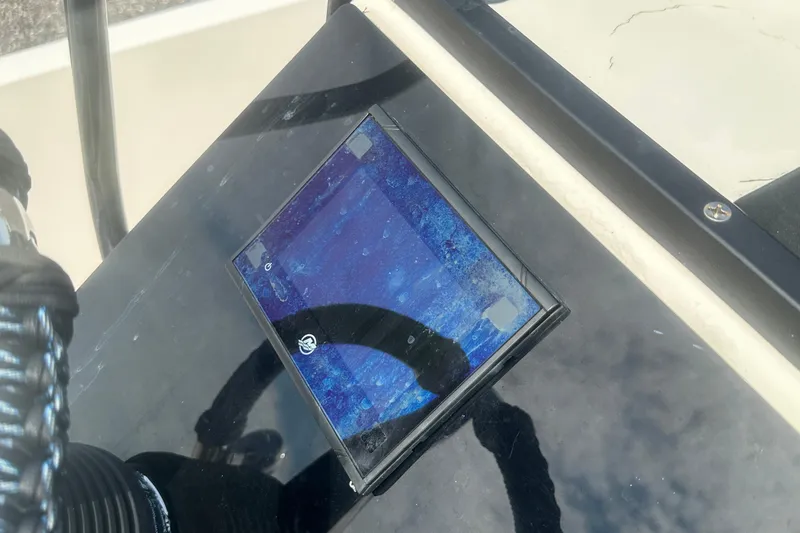 Slide: The Image of Control panel of a 2003 Key West 196 Bay Reef boat, featuring a digital display. - 19