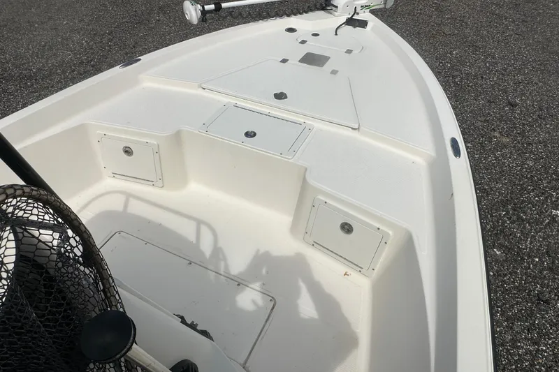 Slide: The Image of 2003 Key West 196 Bay Reef boat deck with storage compartments and trolling motor. - 20