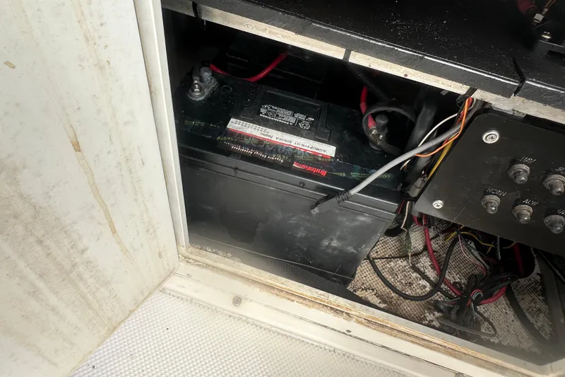 Slide: The Image of Battery compartment of a 2003 Key West 196 Bay Reef boat, showing wiring and connections. - 25