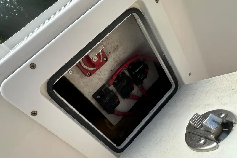Slide: The Image of Electrical compartment of 2003 Key West 196 Bay Reef boat with visible wiring and switches. - 26