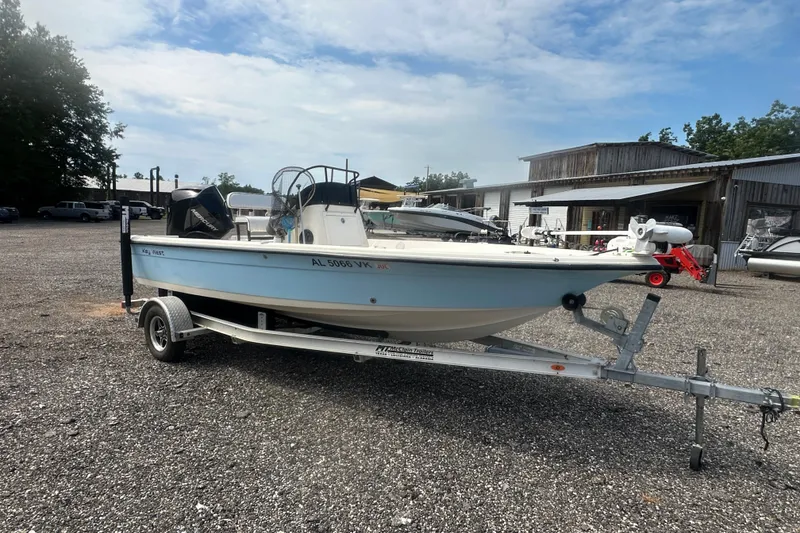 Slide: The Image of 2003 Key West 196 Bay Reef boat on trailer in outdoor lot. - 8
