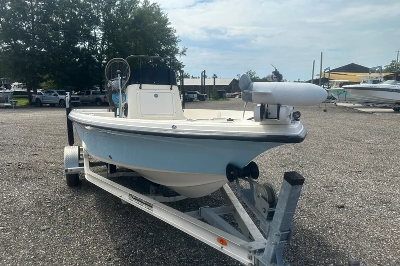 Slide: The Image of 2003 Key West 196 Bay Reef boat on trailer in outdoor setting. - 9