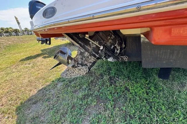 Slide: The Image of 2008 Chaparral Sunesta 224 boat with visible propeller and hull on grassy area. - 11