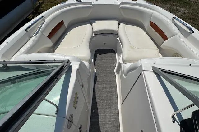 Slide: The Image of 2008 Chaparral Sunesta 224 boat interior with white seating and open bow design. - 16