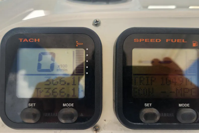 Slide: The Image of Close-up of Everglades 230CC 2011 boat dashboard with tachometer and speed fuel gauges. - 15