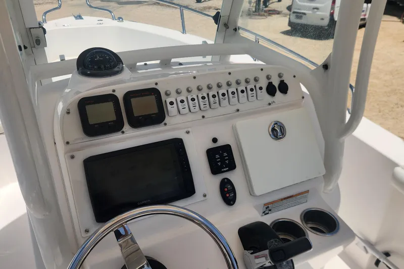Slide: The Image of 2011 Everglades 230 Center Console dashboard with navigation instruments and controls. - 8