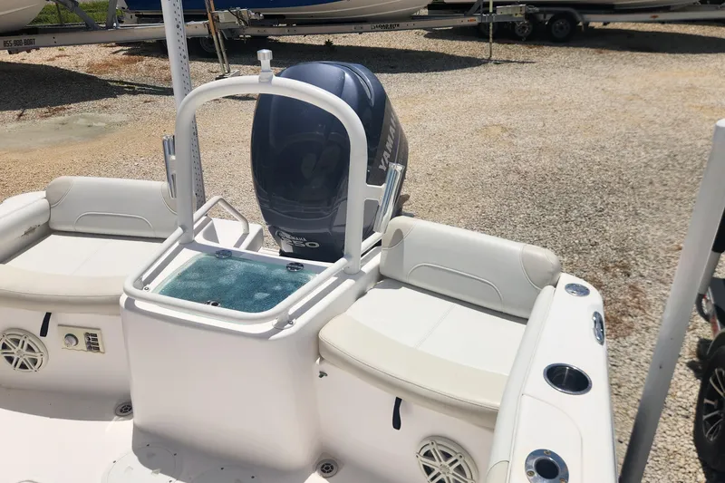 Slide: The Image of 2011 Everglades 230CC boat with Yamaha engine, featuring comfortable seating and modern design. - 9
