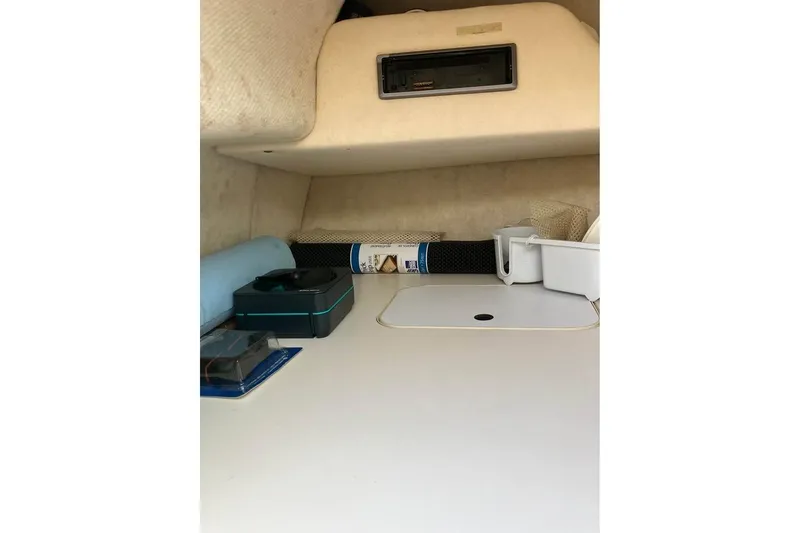 Slide: The Image of Interior cabin of 2004 Sea Ray 215 Weekender boat with storage and equipment. - 4