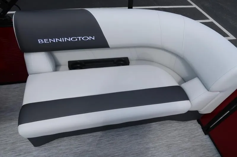 Slide: The Image of 2026 Bennington S Quad Bench 20 SSR with sleek white and black seating. - 13