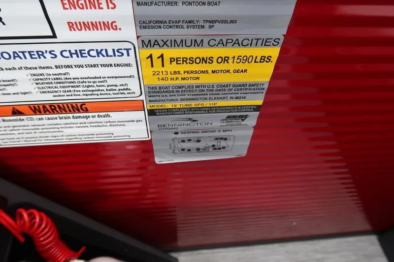 Slide: The Image of 2026 Bennington S Quad Bench 20 SSR capacity label, maximum 11 persons or 1590 lbs. - 16