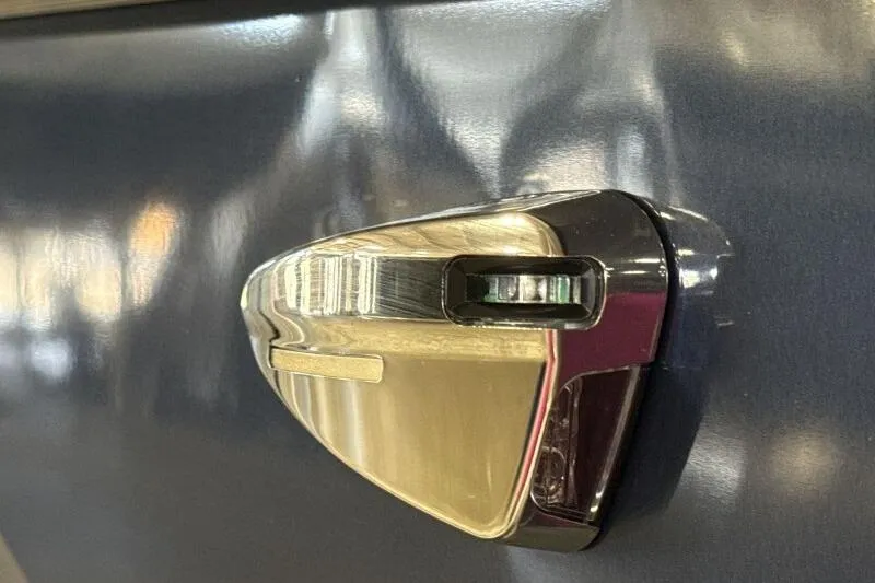 Slide: The Image of 2026 Bennington 22 SSRSE pontoon boat with cover in a warehouse setting. - 13