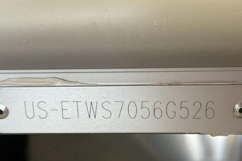 Slide: The Image of 2026 Bennington 22 SSRSE boat seat with gray and navy upholstery. - 21