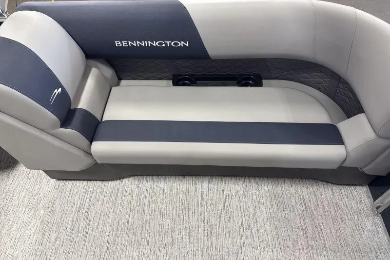 Slide: The Image of 2026 Bennington 22 SSRSE boat seating, gray and navy upholstery, elegant design. - 22