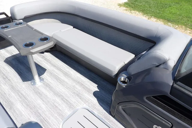 Slide: The Image of 2026 Bennington M Swingback 24 MSB interior with gray seating and cupholders. - 12