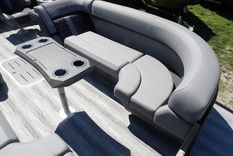 Slide: The Image of Luxurious seating on 2026 Bennington M Swingback 24 MSB pontoon boat with cupholders. - 13